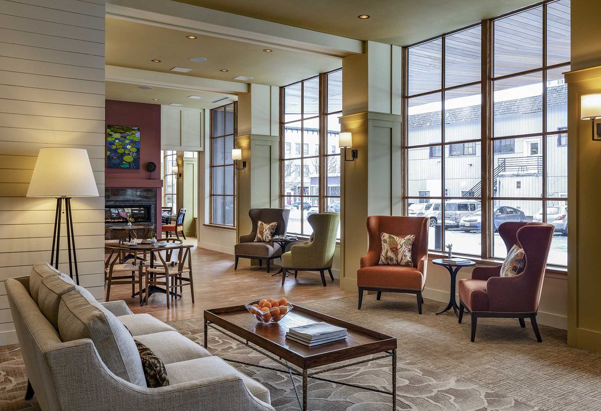 A modern lobby with ample seating and large windows.