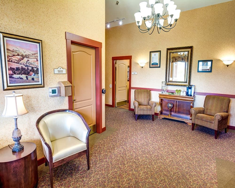 Cozy waiting room with comfortable chairs and elegant decor.