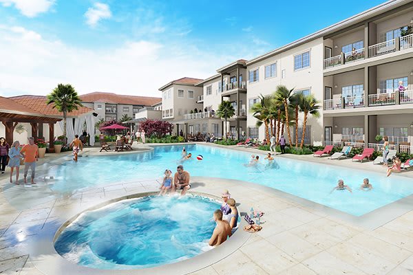 A relaxing pool area at a resort with a jacuzzi and people enjoying the sunny day.