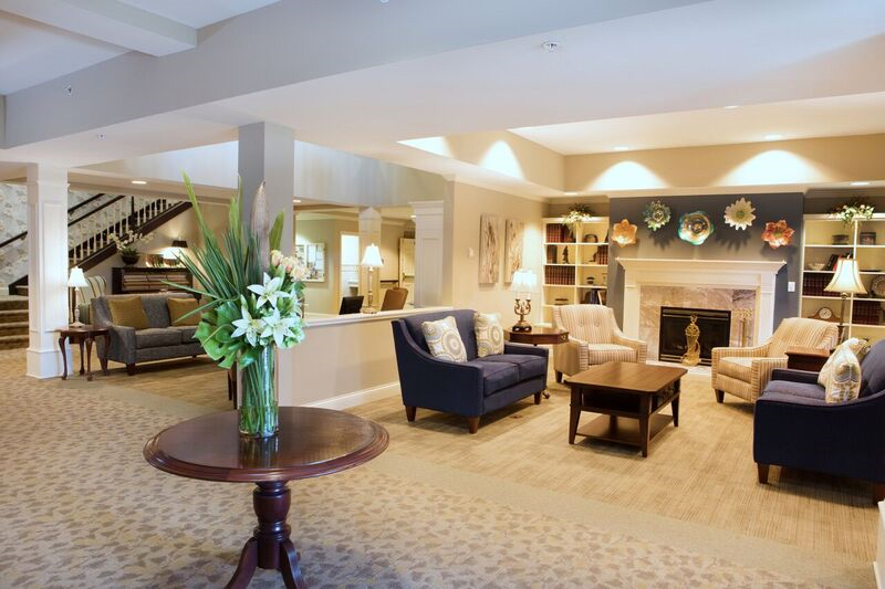 A cozy living room with comfortable seating and a fireplace.