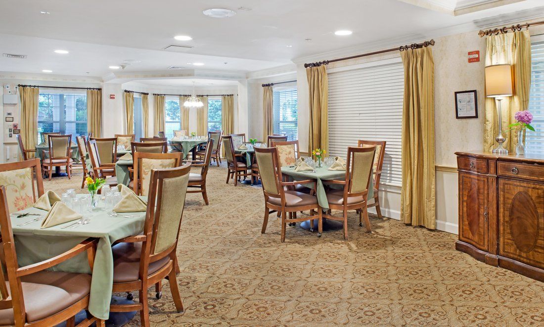 A well-appointed dining room with neatly arranged tables and chairs.