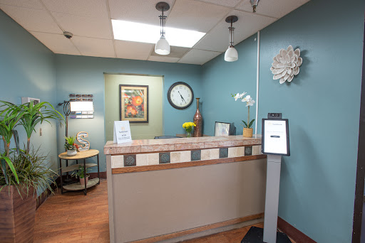 A welcoming reception area featuring modern decor and a calming blue color scheme.