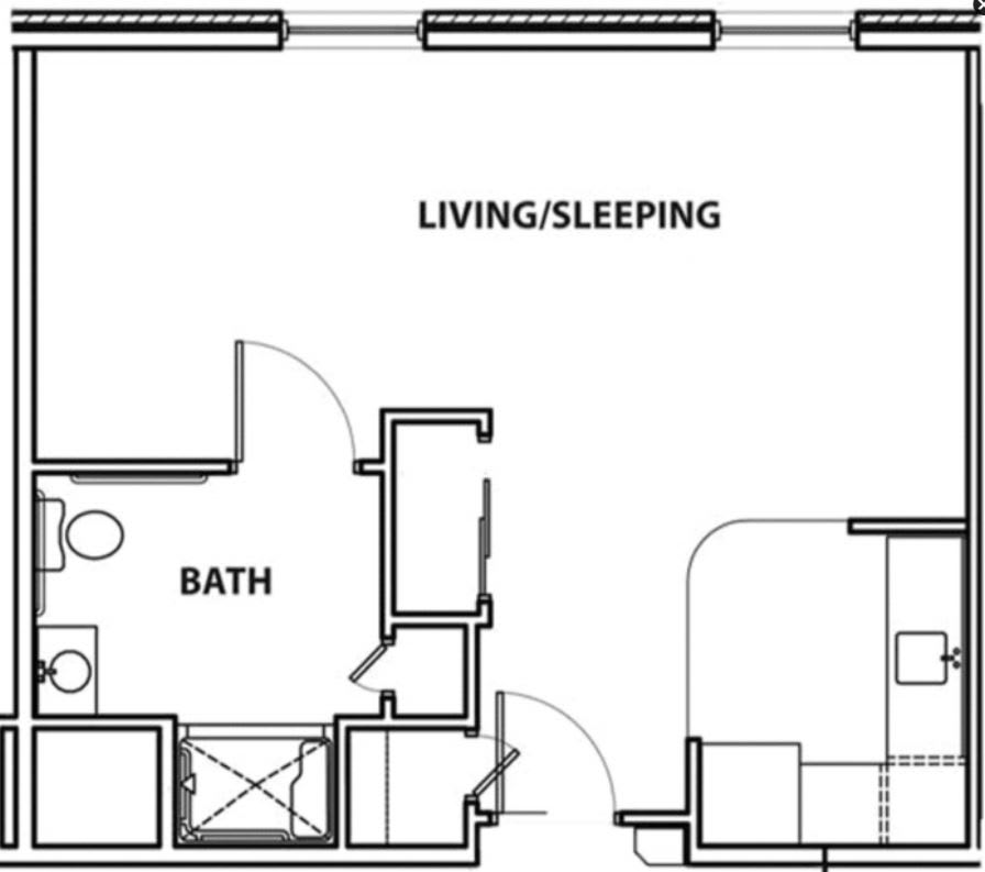 Studio apartment floor plan showing living/sleeping area and bathroom layout.