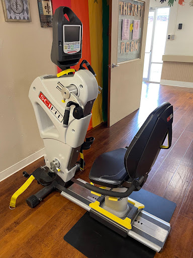 A rowing machine set up for use in a fitness or rehabilitation space.
