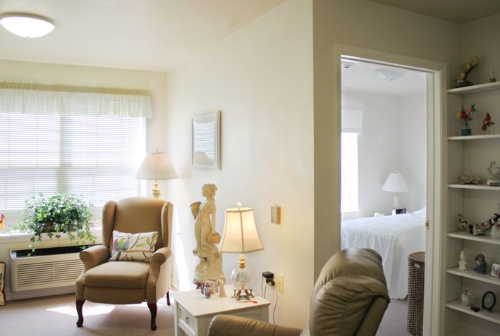 A cozy living room with neutral tones and comfortable seating.
