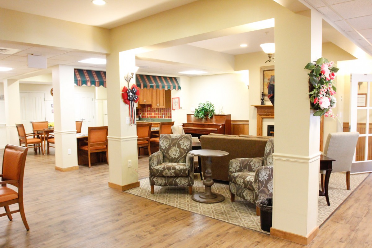 A cozy living area with comfortable seating and a piano.
