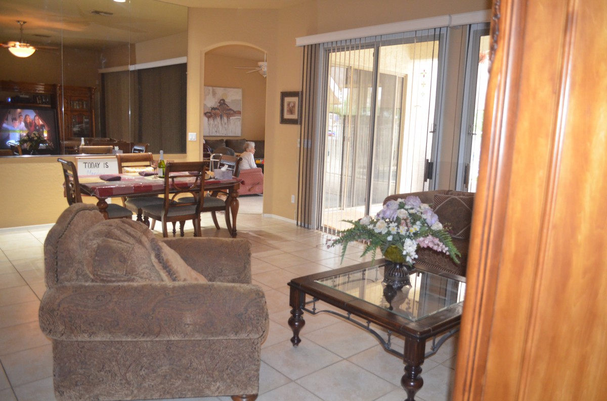 A cozy living room and dining area with comfortable furniture and elegant decor.