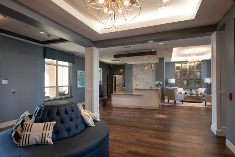 A modern lobby with stylish furniture and elegant lighting features.