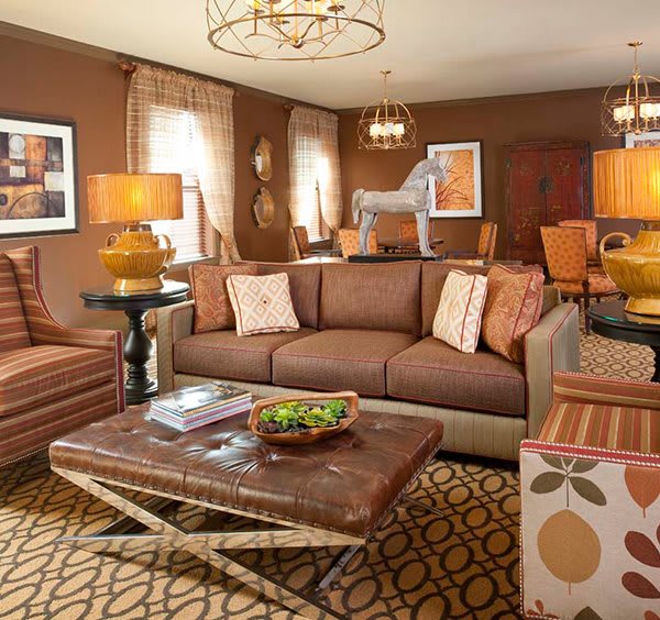 A cozy living room with a brown color scheme, featuring a comfortable sofa, stylish coffee table, and warm lighting.
