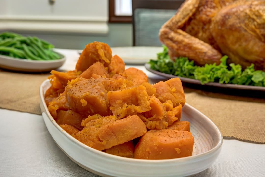 A dish of yams served as a side for a holiday meal.