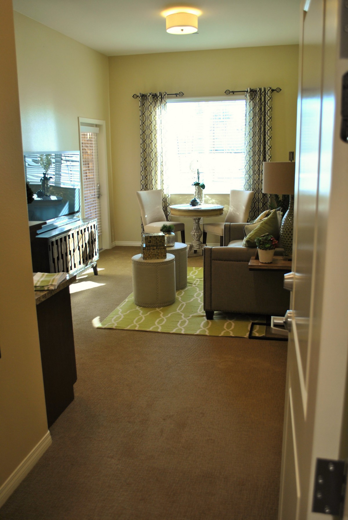 A cozy living room with modern furniture and natural lighting.