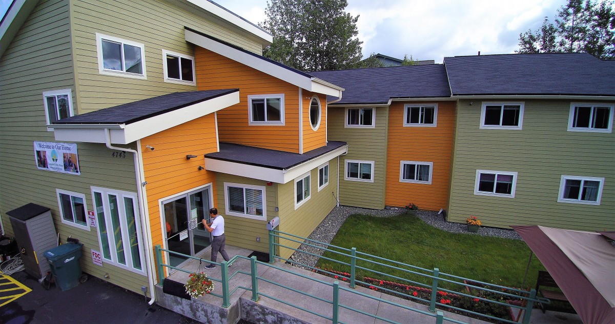 A modern, colorful residential building with a unique architectural design.