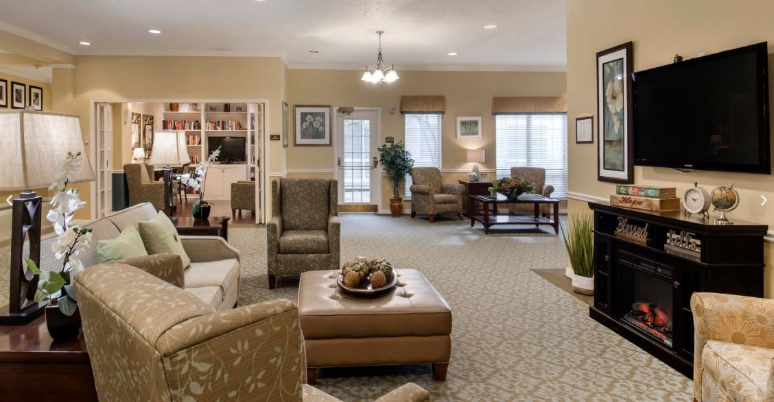 A cozy and well-lit living room with comfortable seating and stylish decor.