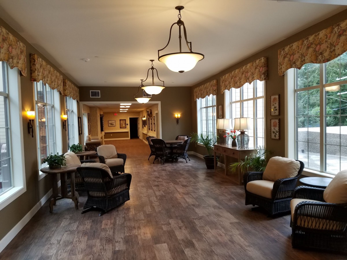 A spacious lobby area with comfortable seating, large windows, and elegant lighting.