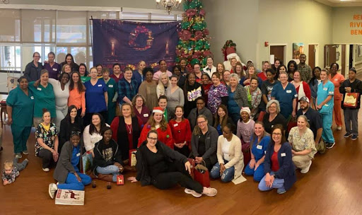 A joyful gathering of community members celebrating the holiday season together.