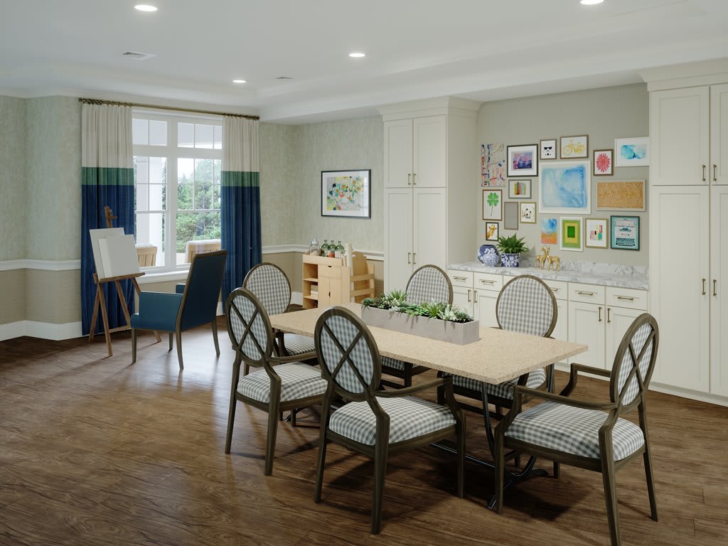 A well-furnished dining room with a large table, several chairs, decorative elements, and artwork on the walls.