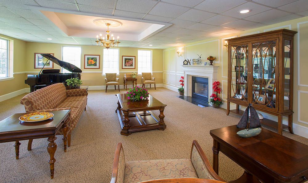 A well-decorated living room featuring elegant furniture and a cozy fireplace.