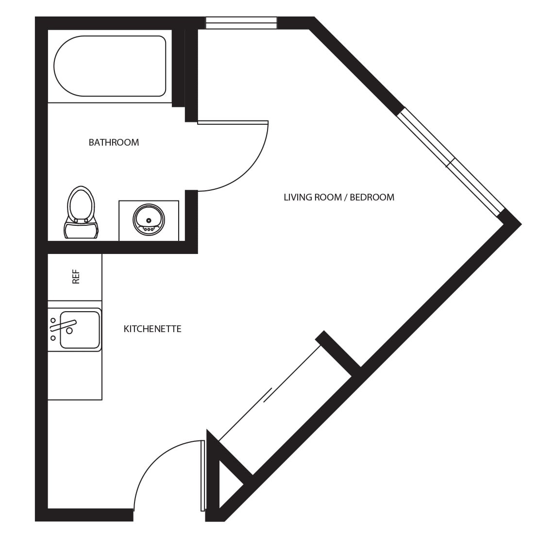 A compact floor plan featuring a bathroom and kitchenette area.