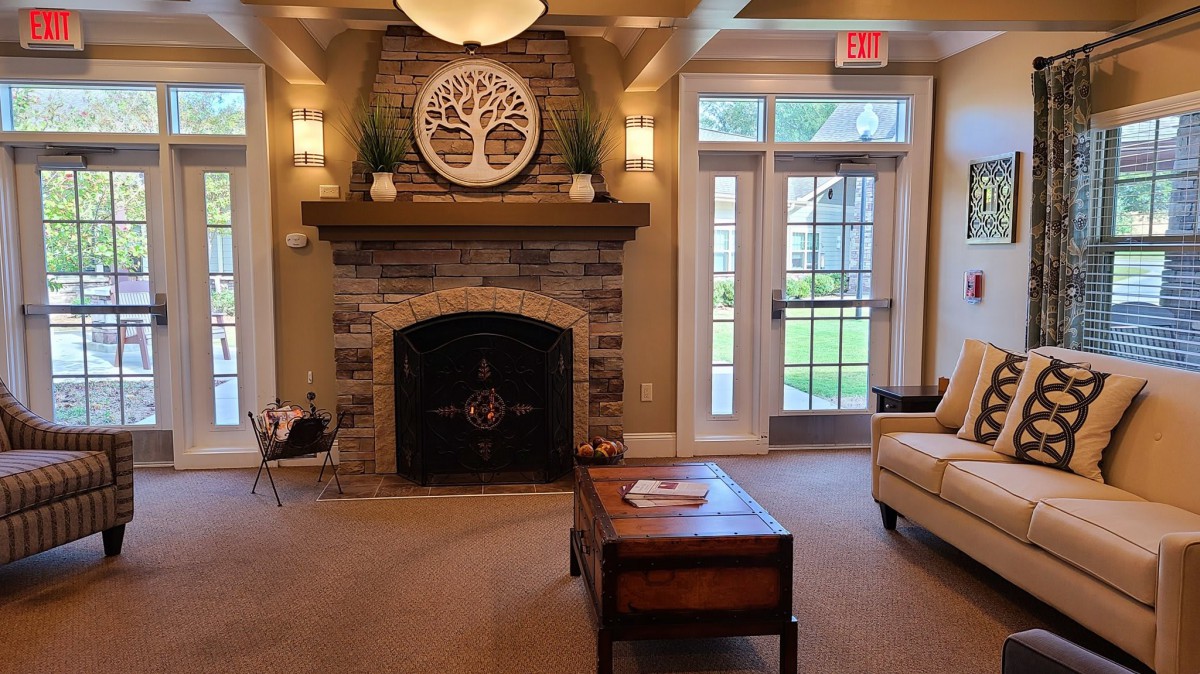 A cozy living room with a fireplace and elegant decor.