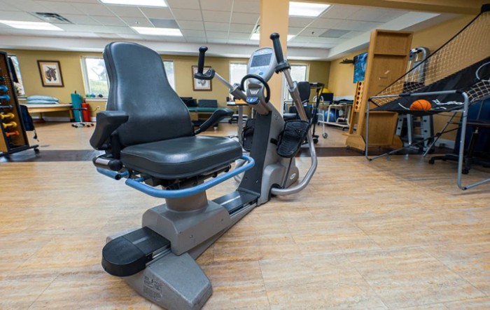 A recumbent exercise bike in a fitness center.