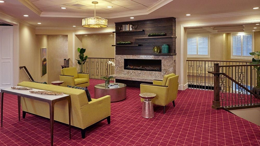 Modern lobby with a cozy seating area and fireplace.