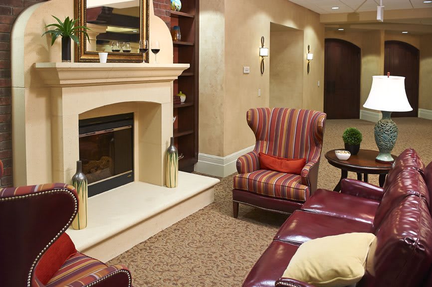 A cozy living room featuring a fireplace and traditional decor.