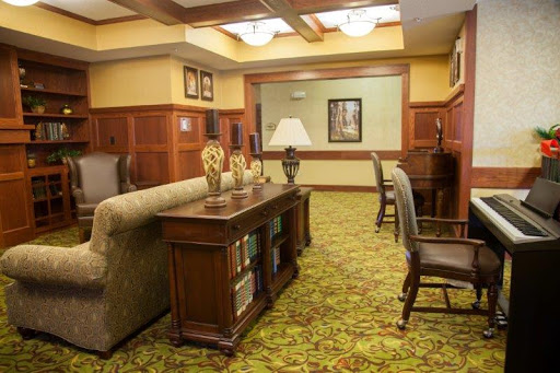 A cozy lobby area featuring a combination of comfortable seating and elegant decor.