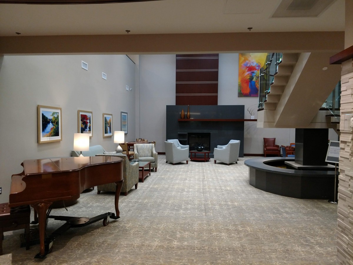 A modern lobby with comfortable seating and contemporary artwork.