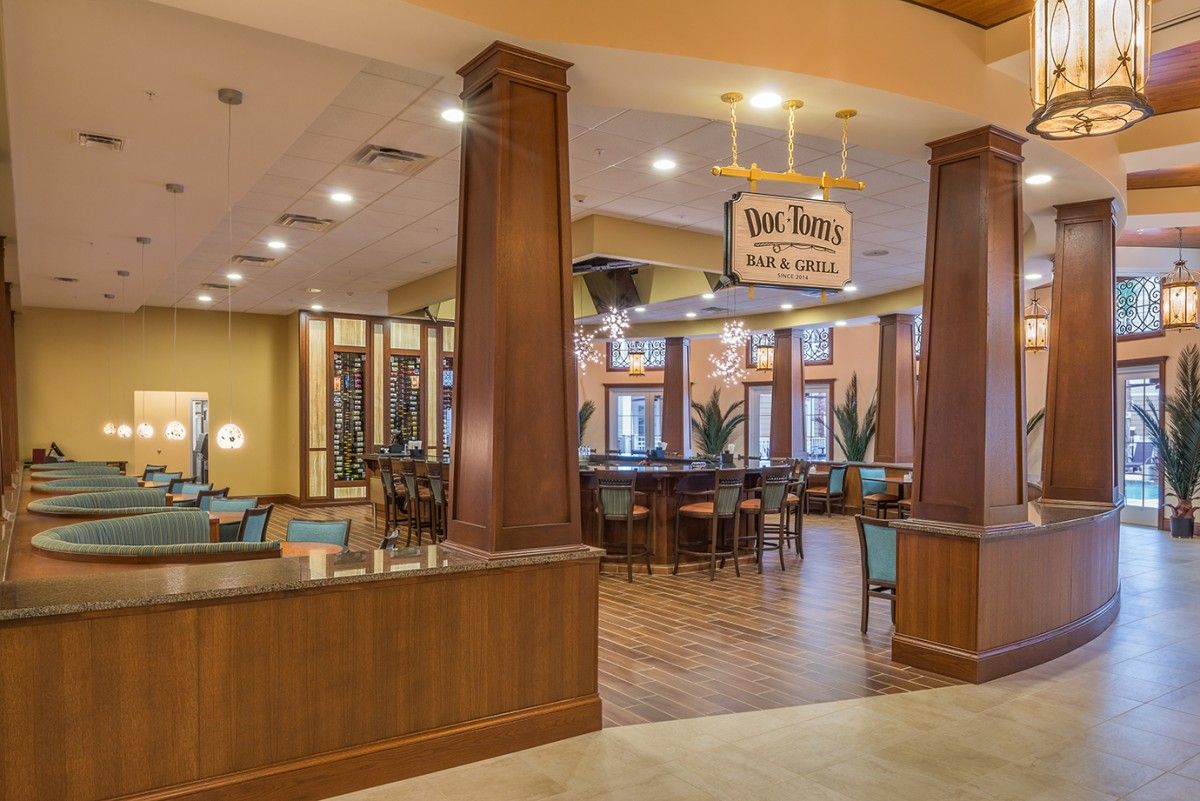A cozy and inviting restaurant interior featuring wooden decor and comfortable seating arrangements.