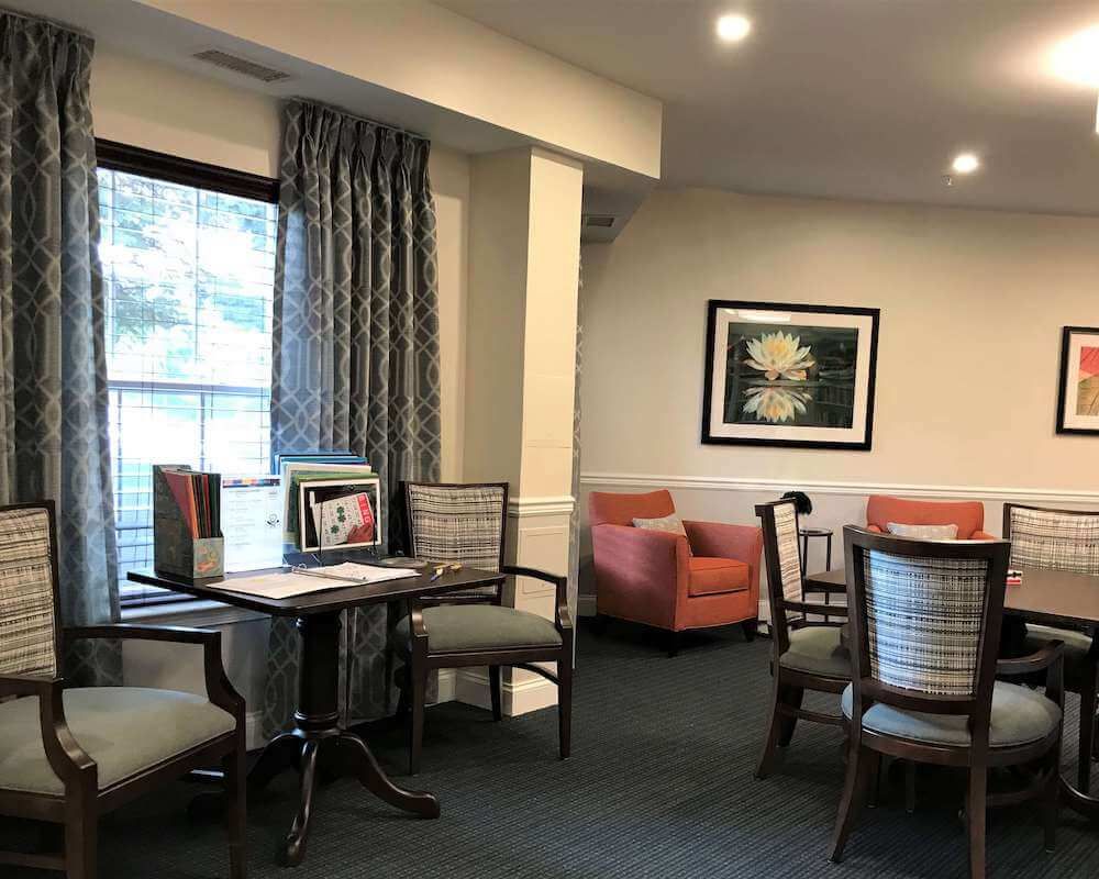 A cozy living room setup with comfortable seating and wall art.