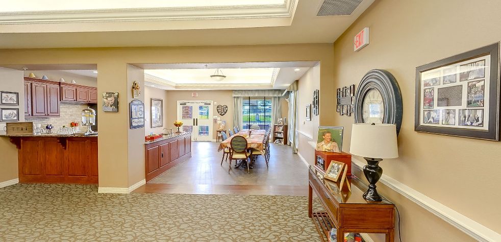 A spacious and bright living and dining area with comfortable furnishings and decorative elements.