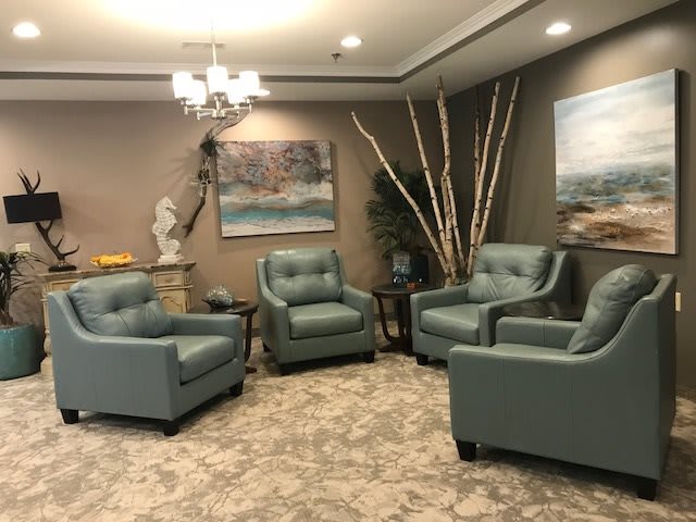 A cozy living room setup with comfortable chairs and decorative elements.