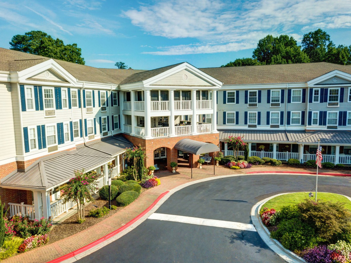 A scenic view of a residential building with well-maintained landscaping.