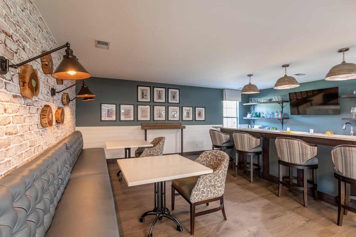 A modern cafe interior with comfortable seating and stylish lighting.