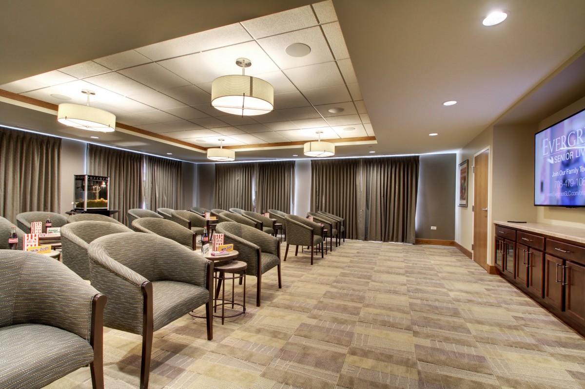 A modern conference room with arranged seating and soft lighting.