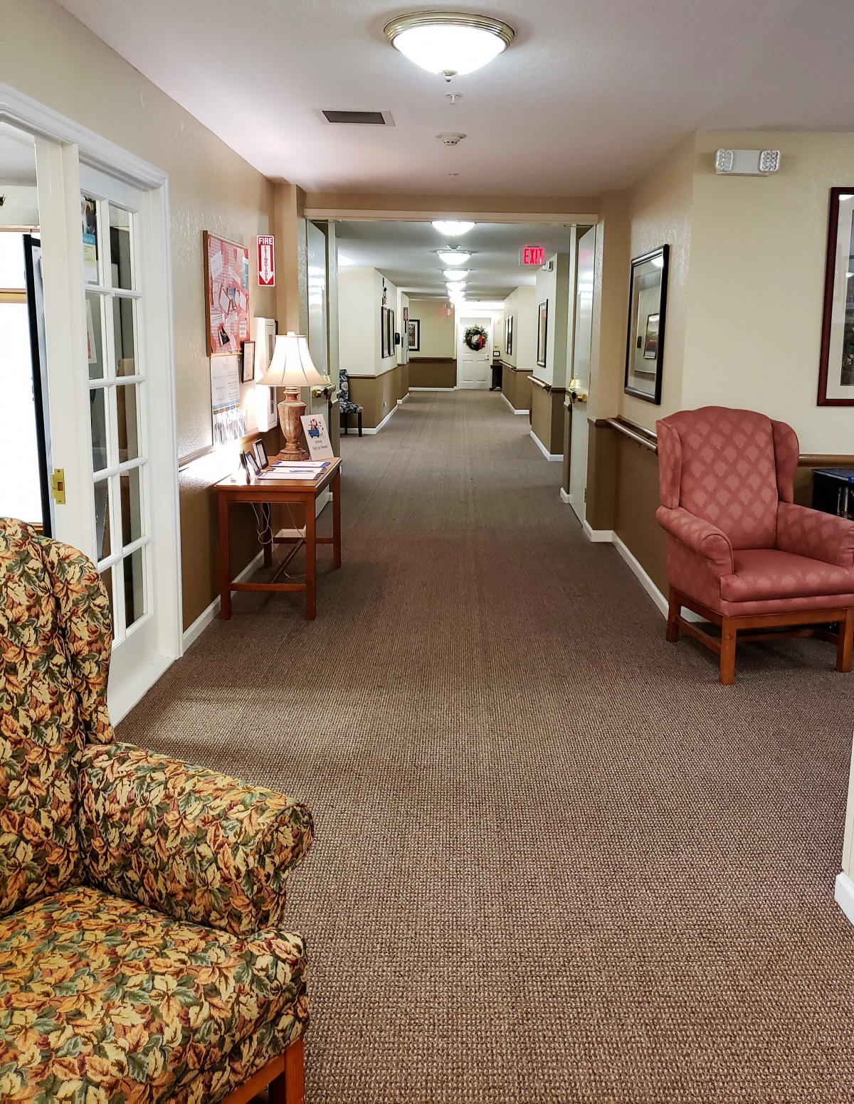 A cozy hallway with seating and warm lighting.