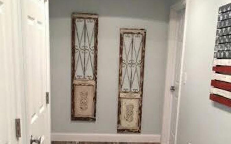 Vintage-style decorative panels on a wall.
