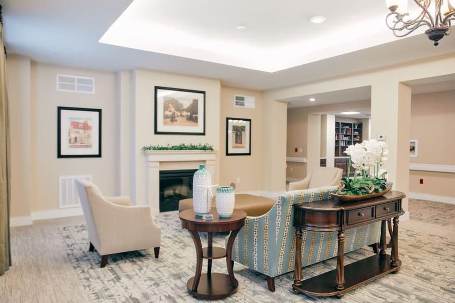 A cozy living room with comfortable seating and elegant decor.