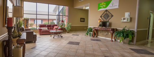A welcoming lobby featuring comfortable seating and decorative plants.