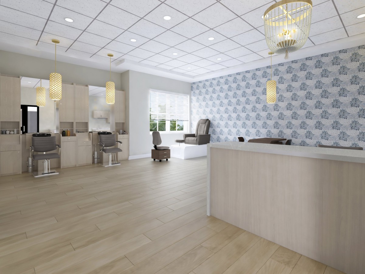 Modern salon interior with a reception desk and spa chairs.