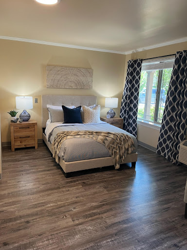 A cozy and modern bedroom featuring stylish furnishings and ample natural light.