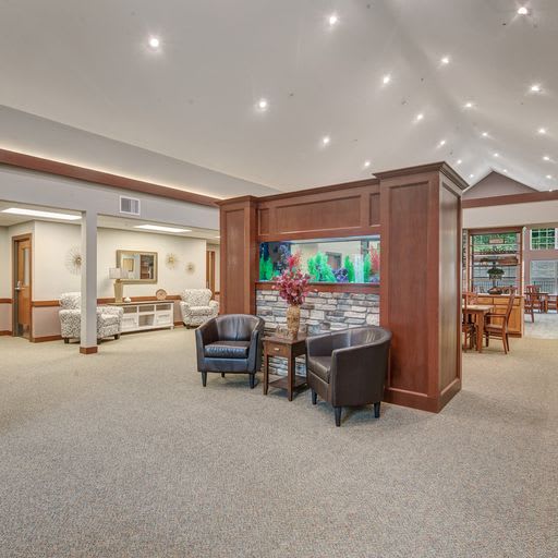 Spacious and welcoming lobby with comfortable seating and elegant wood accents.