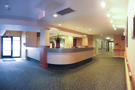A spacious and modern hotel lobby featuring a sleek reception desk.