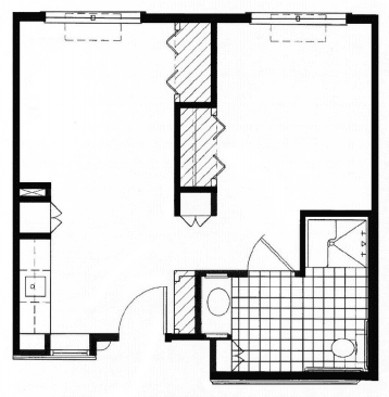 A simple floor plan illustrating the layout of a residential space, including a bathroom, kitchen, and living area.