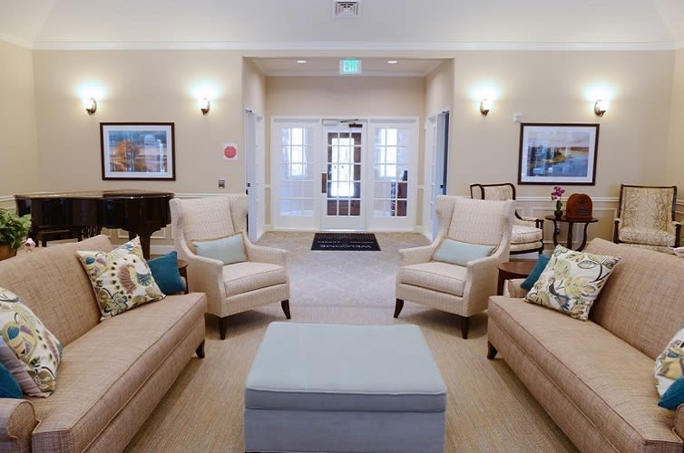 A cozy living room with comfortable seating and elegant decor.