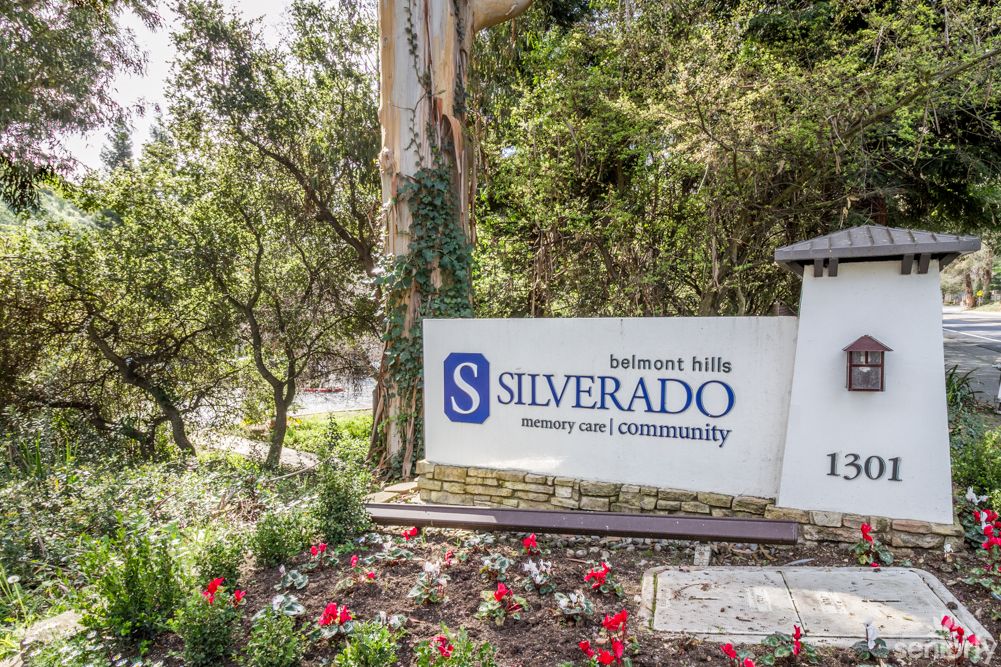 Entrance sign for the Silverado Hills community surrounded by trees and flowers.