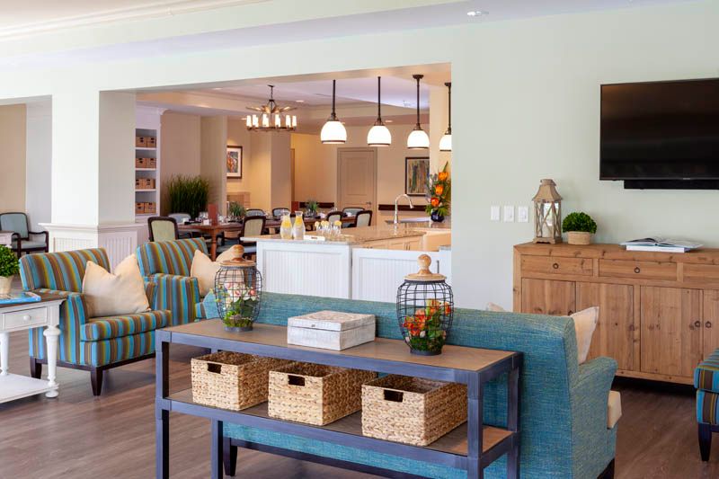A spacious open-concept living area featuring modern furniture and home decor elements.