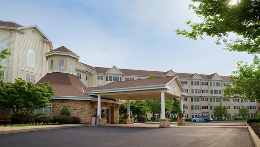 A welcoming entrance of a hotel showcasing a modern architectural design.