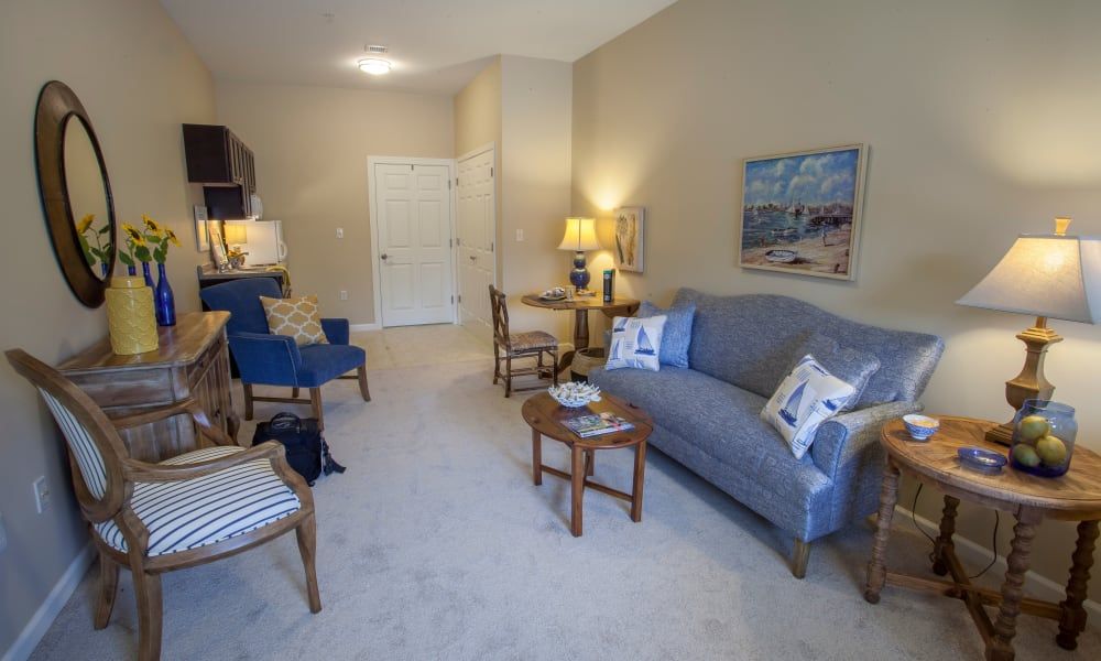 A cozy living room with comfortable seating and warm lighting.