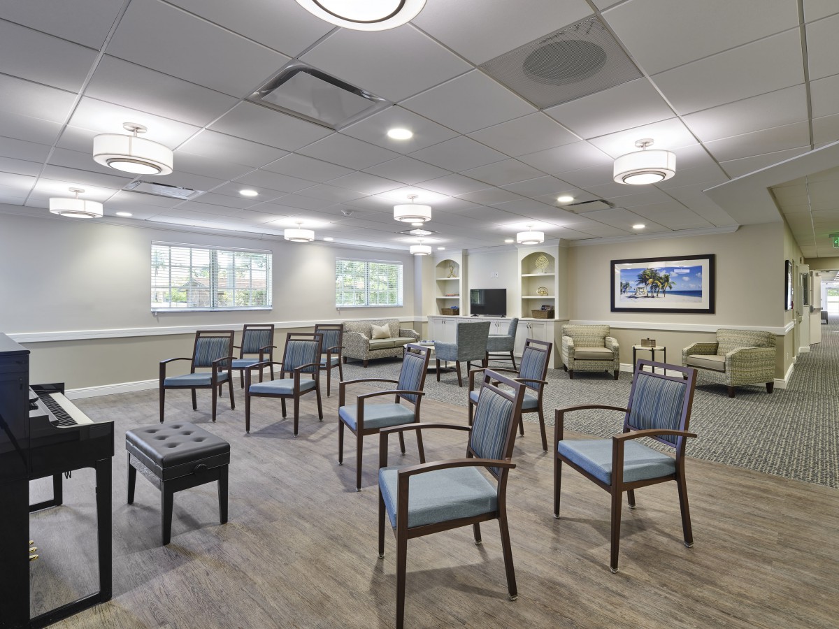 A modern meeting room with chairs arranged for a conference.